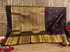 Kasturi: Coffee-Brown Kanjeevaram, Peacock-Coin Buttis