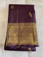 Kasturi: Coffee-Brown Kanjeevaram, Peacock-Coin Buttis