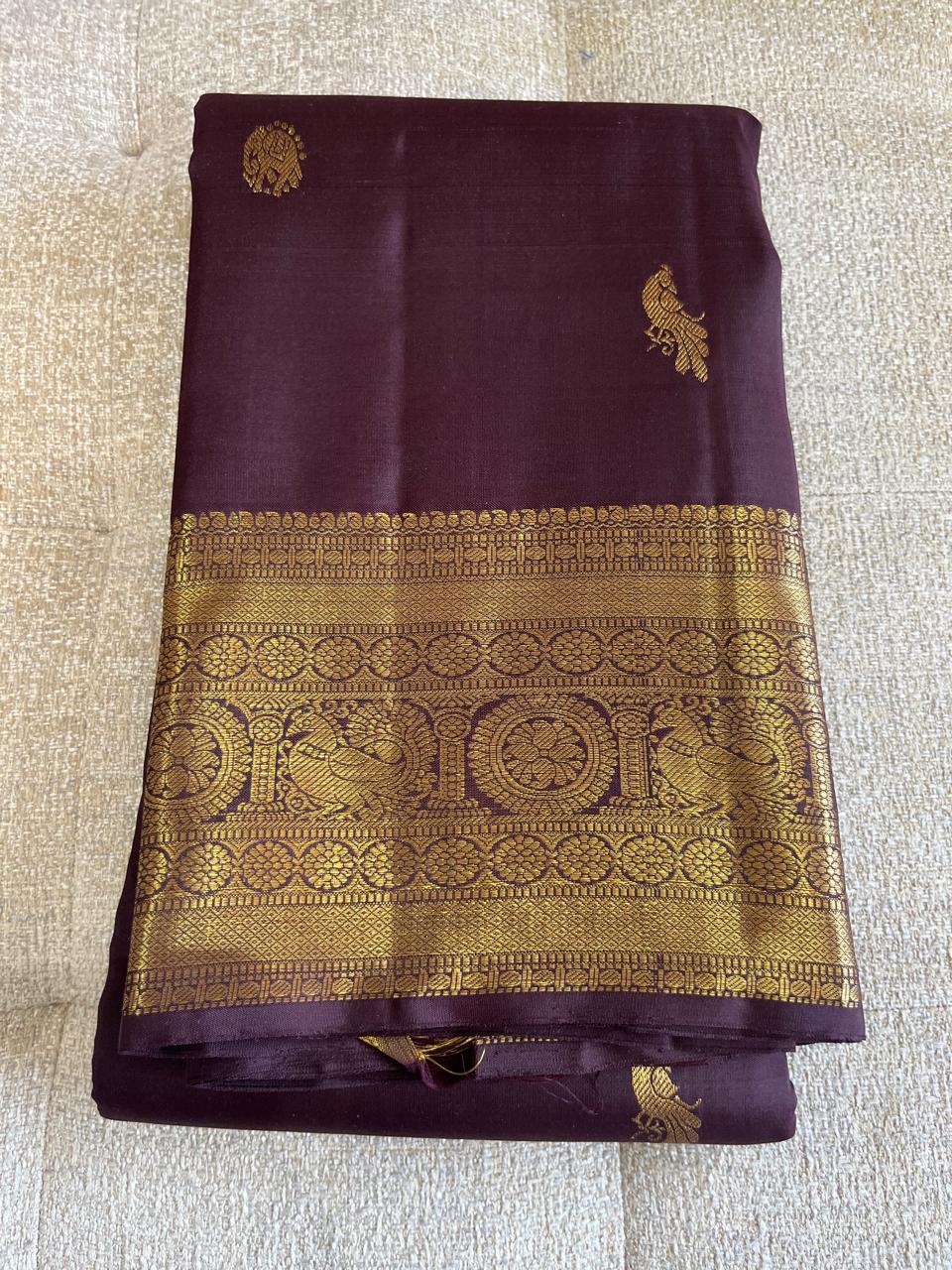 Kasturi: Coffee-Brown Kanjeevaram, Peacock-Coin Buttis
