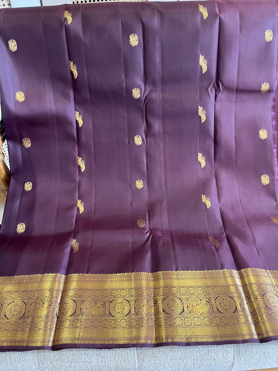 Kasturi: Coffee-Brown Kanjeevaram, Peacock-Coin Buttis