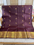 Kasturi: Coffee-Brown Kanjeevaram, Peacock-Coin Buttis