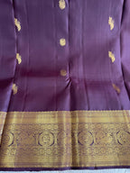 Kasturi: Coffee-Brown Kanjeevaram, Peacock-Coin Buttis