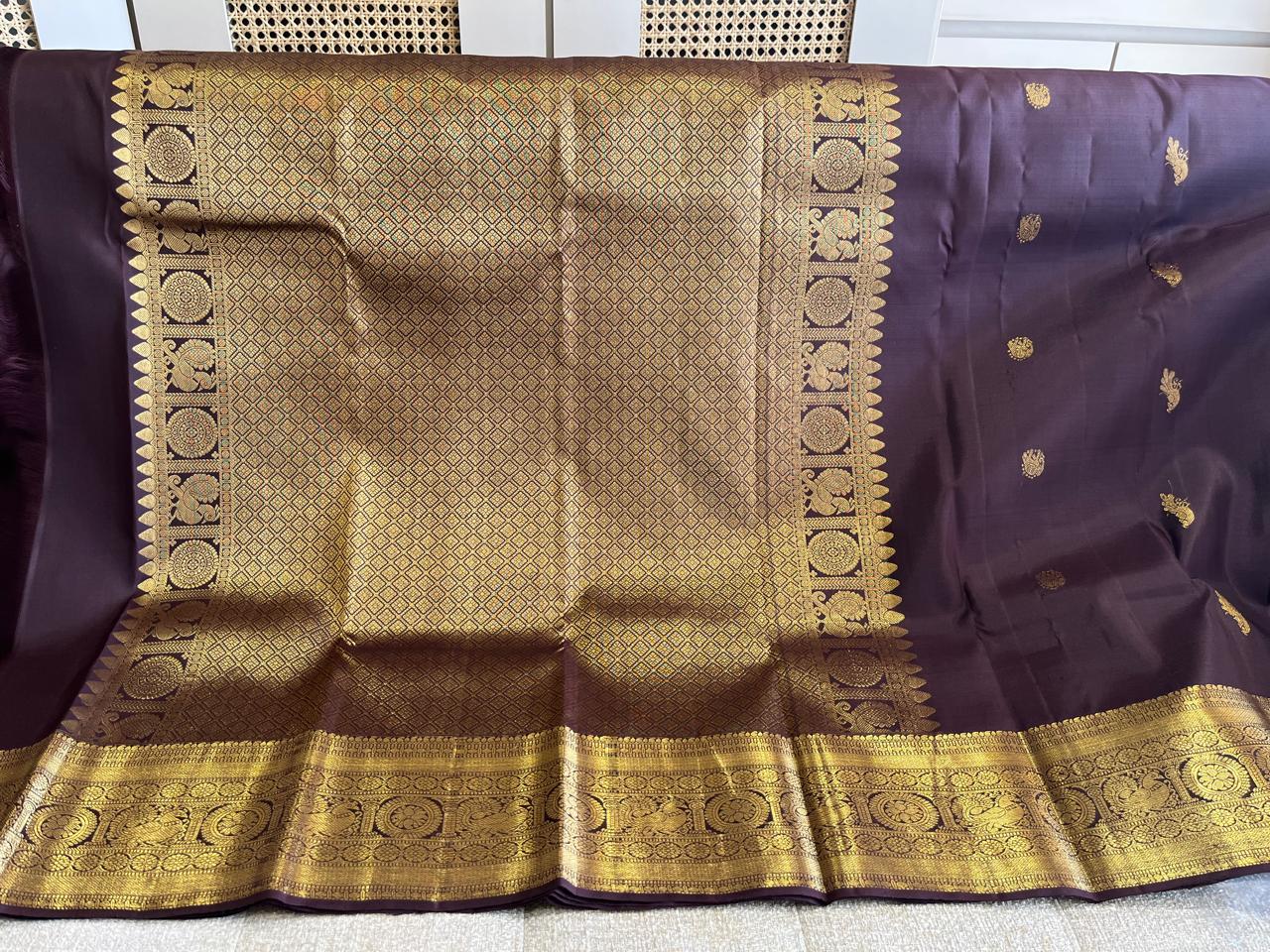 Kasturi: Coffee-Brown Kanjeevaram, Peacock-Coin Buttis