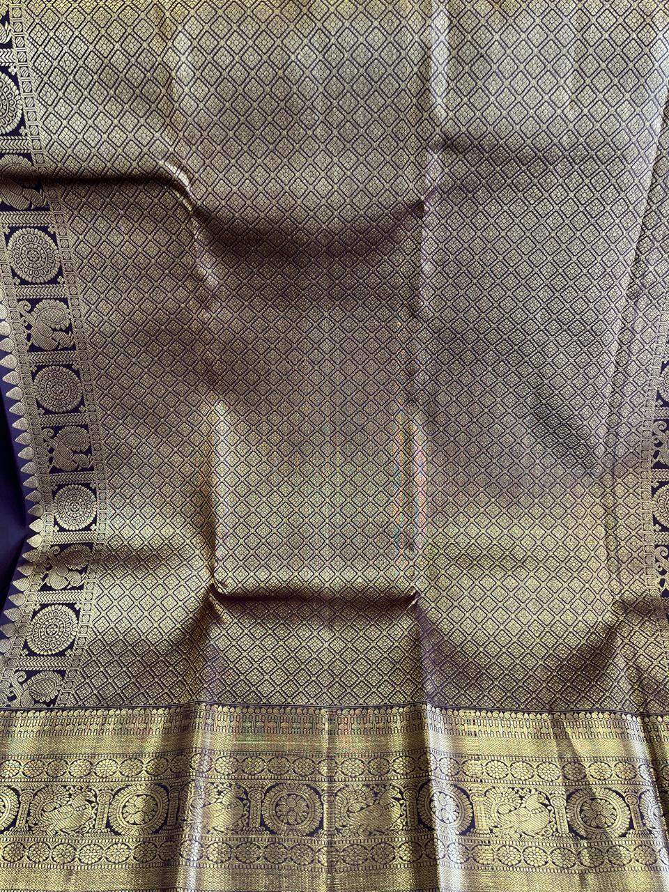 Kasturi: Coffee-Brown Kanjeevaram, Peacock-Coin Buttis